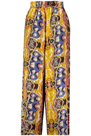 CALÇAS COM ATACADORES DESIGUAL MULHER AMARELAS